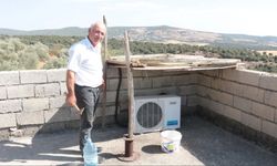 Kahramanmaraş'ta Sıcaktan arıza veren klima motoru için gölgelik yaptı